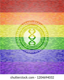 dna icon inside emblem on mosaic background with the colors of the LGBT flag