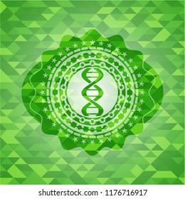 dna icon inside green emblem with triangle mosaic background