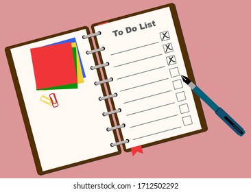 To Do List on a notebook on a table.