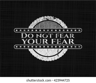 Do not fear your fear chalkboard emblem written on a blackboard