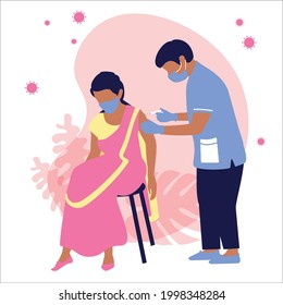A doctor in a blue medical suit, gloves and a mask gives an injection of a vaccination for immunization against coronavirus to an Indian woman in a sari. Protection  the spread of covid 19. Vector