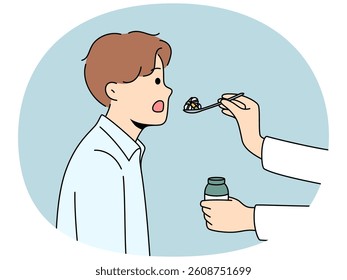 Doctor hand with pills in spoon near patient opening mouth to take painkillers and cure disease. Clinic patient receives pharmacological medications from therapist working in field healthcare.