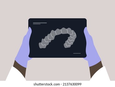 Doctor holding an x-ray teeth scan, dentist treatment 