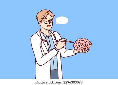 Doctor holds brain in hand explaining work of neurons to students of medical college or university. Concept studying human brain to find possibility of treating alzheimer disease or dementia