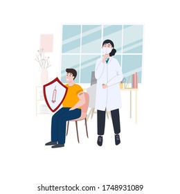 The doctor just vaccinated the young man and now he is protected from the disease. A man holds a hiding shield. Vaccination and disease protection concept illustration. In the doctor’s office.