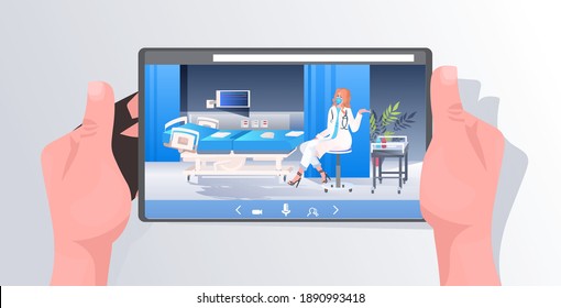 doctor in mask and protective suit sitting near hospital bed on tablet screen covid-19 pandemic fight against coronavirus concept clinic ward interior horizontal full length vector illustration