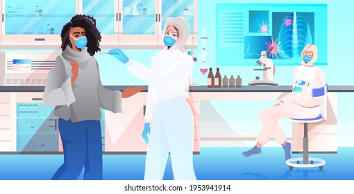 doctor in mask taking swab test for coronavirus sample from woman patient PCR diagnostic procedure