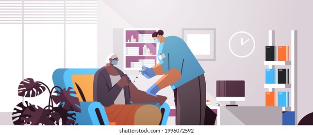 doctor in mask vaccinating old patient practitioner giving injection to senior woman fight against coronavirus vaccination