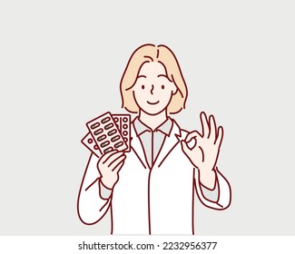 Doctor with medication. woman doc holding pills showing ok-sign. Hand drawn style vector design illustrations.