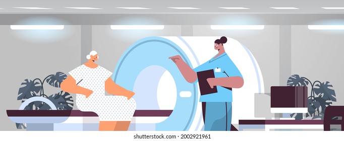 doctor with senior patient in tomography machine magnetic resonance imaging mri equipment hospital radiology