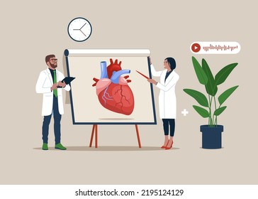 Doctor woman pointing on demonstration board with human heart explain its opportunities. Medical conference.