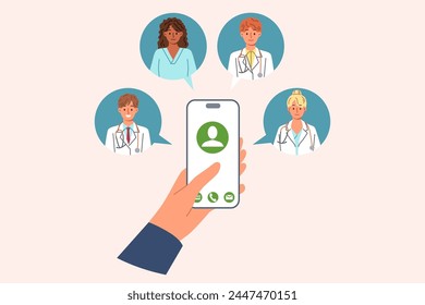 Doctors around mobile phone in patient hand, for concept calling medical personnel at home, for first aid. Person calls doctors for advice when symptoms of illness or deterioration in health appear