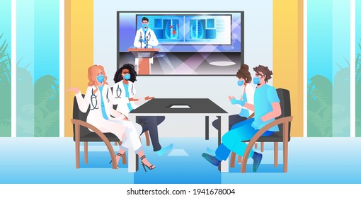 doctors having virtual conference medical specialists in masks discussing during video call coronavirus pandemic