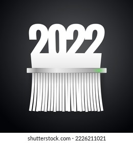 El documento 2022 se corta en trituradora en el fondo oscuro. Recortes incluidos.