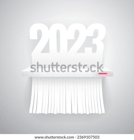 Document 2023 is cut into shredder on light background. Clipping paths included.