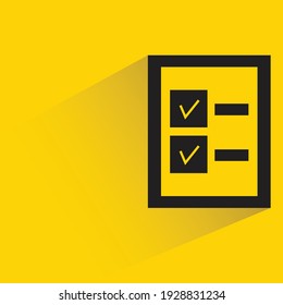 document and check marks with shadow on yellow background