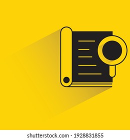 document and magnifier with shadow on yellow background