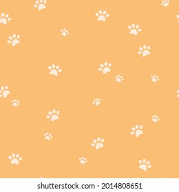 Dog or cat paw silhouette seamless pattern. Animal yellow repeat background, simple shape ornament for wallpaper, or wrapping paper, modern trendy hand drawn vector illustration, flat cartoon style