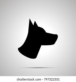 Dog head silhouette, simple black icon with shadow
