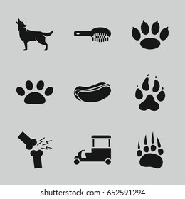 Dog icons set. set of 9 dog filled icons such as animal paw, wolf, hair brush, hot dog, fast food cart, broken leg or arm