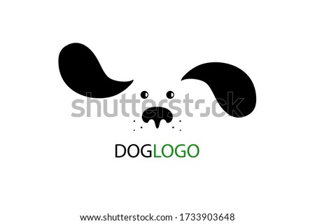 Dog logo design. Cute cartoon dog face with long fluttering ears. Vector illustration