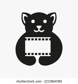 Dog Movie Film Reel Logo Negative Space Concept Vector Template. Dog Holding Film Reel Symbol