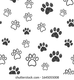 Dog paw doodles seamless pattern. Doggie love background. Puppy cute footprints.
