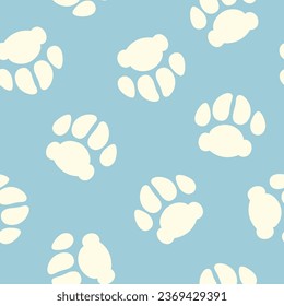 Dog paw footprints seamless pattern with white pet tracks on light blue background. Cute vector domestic animals print design.