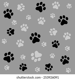 Dog paw prints seamless pattern with black and gray color paw prints