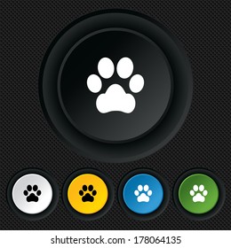 Dog paw sign icon. Pets symbol. Round colourful buttons on black texture. Vector