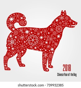 Dog red silhouette with snowflakes. 2018 - Chinese Year of the Dog.  Vector illustration.