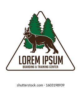 Dog traini logo with type of german sheperd and pine tree