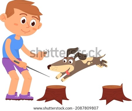 Dog training. Puppy jumping on tree stumps. Boy playing with pet