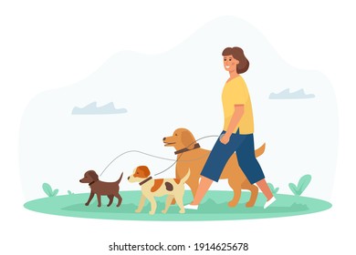 A dog walker, a young pretty woman enjoys the activity in the park with her pets. Pet Care Service.