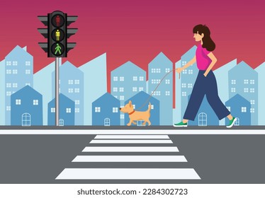 Dog walking with a girl with longhair and high rise building background with evening sky. Urban pet in the city on the street with traffic light and cross walk.