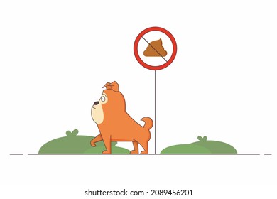 Un perro camina por la calle al lado de un cartel que prohibe la defecación en el césped. 