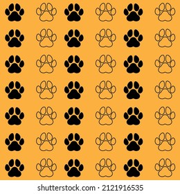 Dog or wolf paws pattern black and outline on orange background