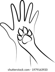 A dog's paw on a human hand.