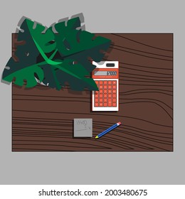 Haciendo multiplicación con calculadora en el escritorio con hojas de Taro