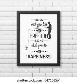 Doing what you like is freedom, liking what you do is happiness  - Quote typographical Background in the realistic square black frame on the brick wall background. Vector EPS10 illustration. 