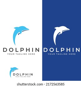 Dolphin logo. Dolphins jump on the waves of the sea or the beach.