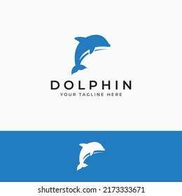 Dolphin logo. Dolphins jump on the waves of the sea or the beach.