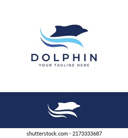 Dolphin logo. Dolphins jump on the waves of the sea or the beach.