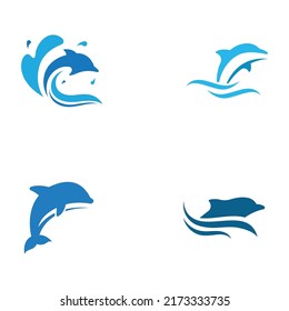 Dolphin logo. Dolphins jump on the waves of the sea or the beach.