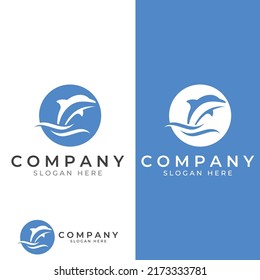 Dolphin logo. Dolphins jump on the waves of the sea or the beach.