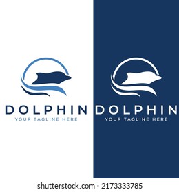 Dolphin-Logo. Delphine springen auf den Wellen des Meeres oder des Strandes.