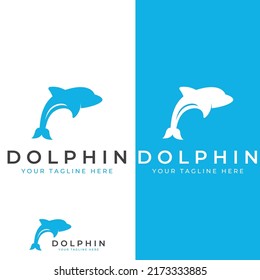 Dolphin logo. Dolphins jump on the waves of the sea or the beach.