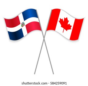 Dominican and Canadian crossed flags. Dominican Republic combined with Canada isolated on white. Language learning, international business or travel concept.