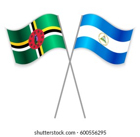 Dominican and Nicaraguan crossed flags. Dominica combined with Nicaragua isolated on white. Language learning, international business or travel concept.