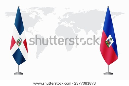 Dominican Republic and Haiti flags for official meeting against background of world map.